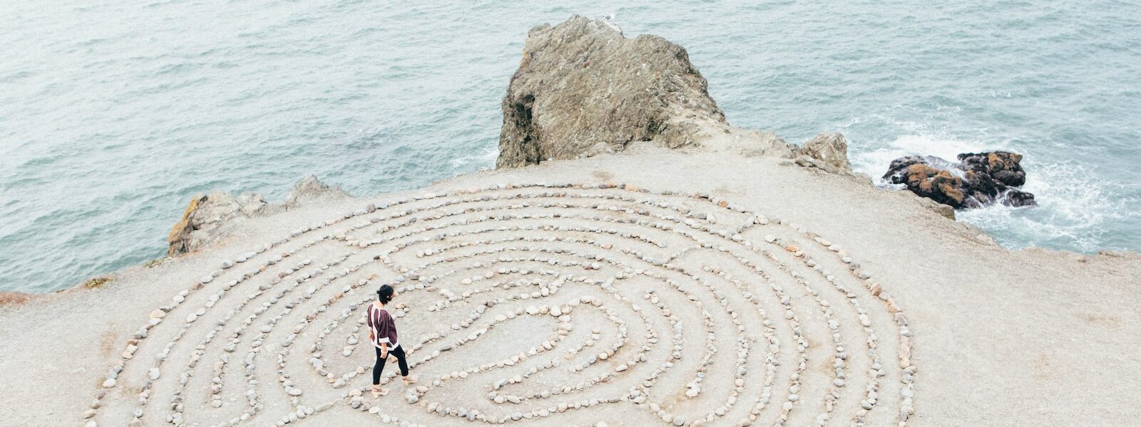 person walking on beach during daytime awareness in the digital age