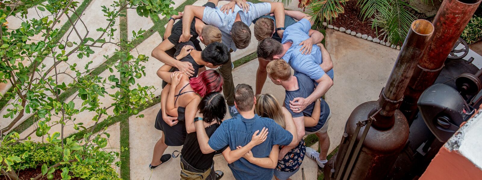 group of people sitting on concrete floor