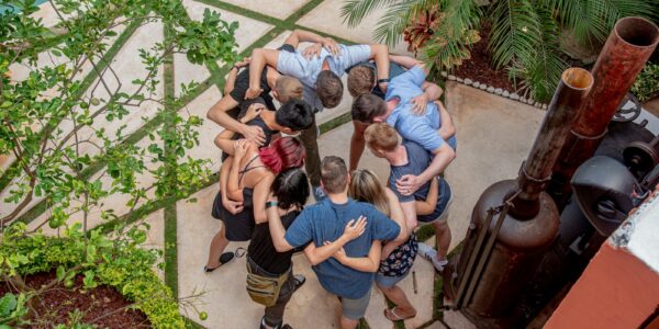 group of people sitting on concrete floor